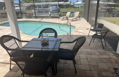 Bokeelia Apartment | Beautiful pool home on canal with 45-foot boat dock. 10 minutes to Gulf by boat.