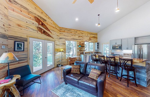 Three Rivers House | Beautiful riverfront home with private dock, fireplace, WiFi, and patio