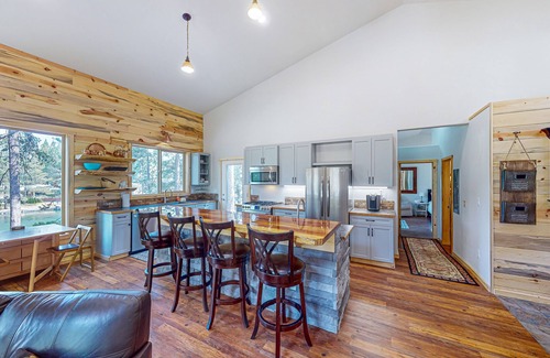 Three Rivers House | Beautiful riverfront home with private dock, fireplace, WiFi, and patio