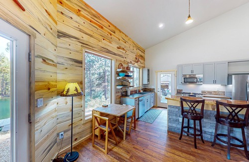 Three Rivers House | Beautiful riverfront home with private dock, fireplace, WiFi, and patio