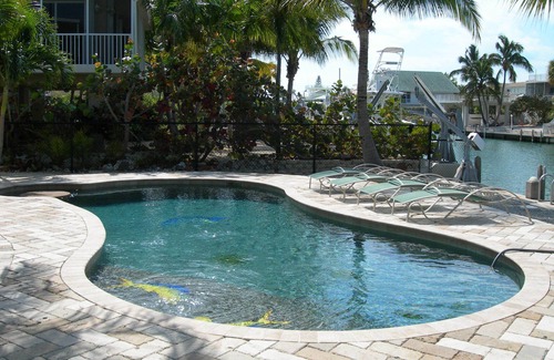 Venetian Shores Villa | Beautiful Venetian Shores, Cozy home, Heated pool, Tiki, Boat Lift, Fish & Dive.