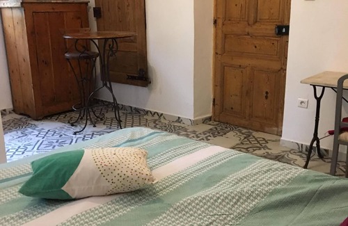 Saint-Jean-du-Pin Bed & Breakfast | Bedroom and terrace, overlooking the garden. It can be combined with the gîte.