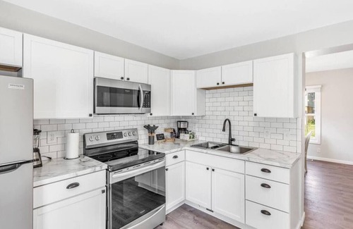 Bay City House | BigBlue! Dog Friendly | Big Groups | First Floor Master Bedroom | HotTub-all yr