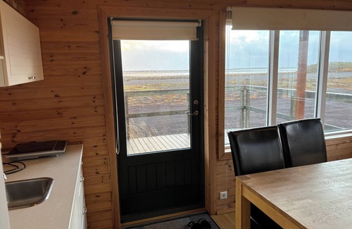 Eyja- og Miklaholtshreppur Cabin | Black sand beachfront cabin with private hot tub