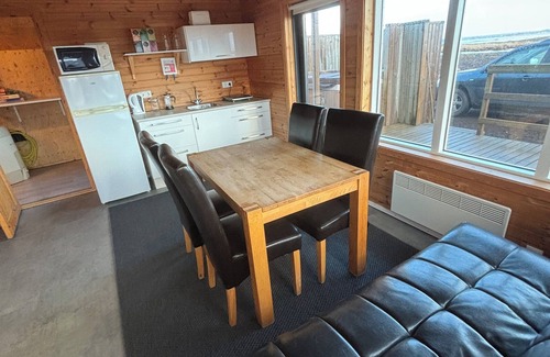 Eyja- og Miklaholtshreppur Cabin | Black sand beachfront cabin with private hot tub