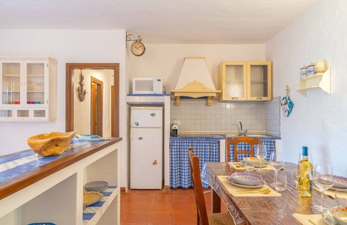 Capo Coda Cavallo Apartment | Blue Dawn: Panoramic Apartment Just Steps from the Sea