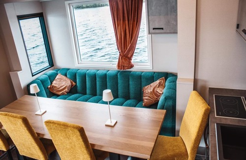 Zeuthen Boat Rental | Boat 'Hausboot Tegel' with Lake View, Wi-Fi and Air Conditioning