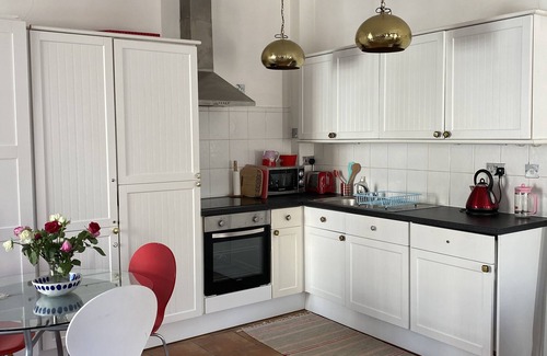 Warwick Apartment | Bright and airy studio apartment with balcony.