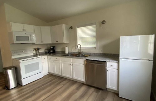 Calvin Cottage | Bright carriage house steps from rail trail and river & 45 minutes to Penn State