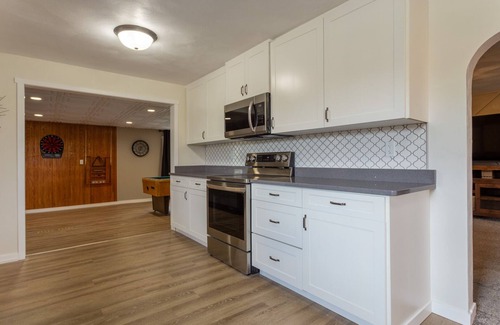 Dyersville House | Bring the whole family to this great home with an acre of room for fun.
