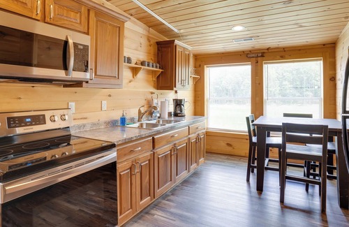 Bryant Cabin | Bryant Cabin Vacation Rental w/ Fire Pit!