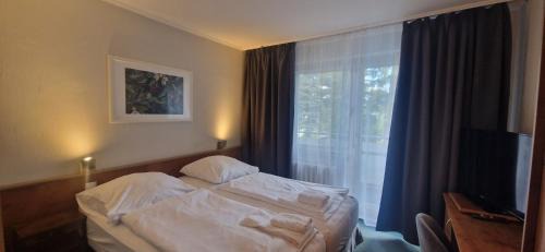 Schlangenluch Hotel | BusinessHotel Am Peetzsee Grünheide