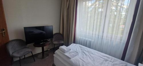 Schlangenluch Hotel | BusinessHotel Am Peetzsee Grünheide