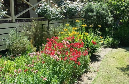 Buxton House | Buxton Gardens by the RivernCountry style home, river flowing thru the backyard