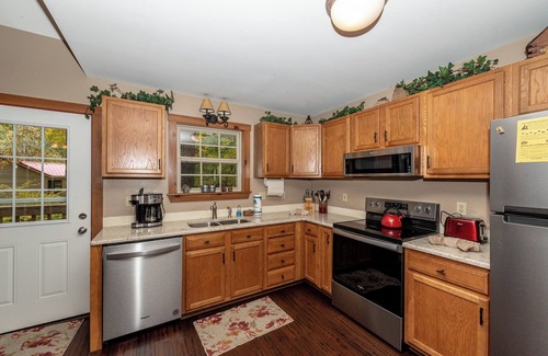 Townsend Cabin | Calling all Golf players! This home is located in a golf course community.