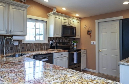 Bayshore Gardens House | CANAL FRONT W/DOCK, Water View, Dock your Boat, Free WIFI Dog - See Note.