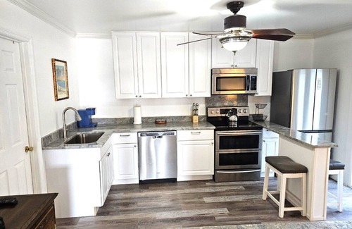 South Daytona House | Canal waterfront newly remodeled 2 bedroom guest suite with pool, patio and dock