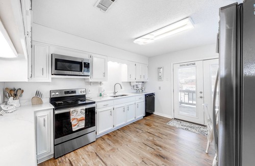 Royal Lagoons House | Canalside home with room for a boat - short walk from the beach