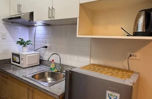 Cagayan de Oro Condo | Canary Yellowish Studio Condo Unit in Tranquil Cagayan De Oro City with WiFi, AC
