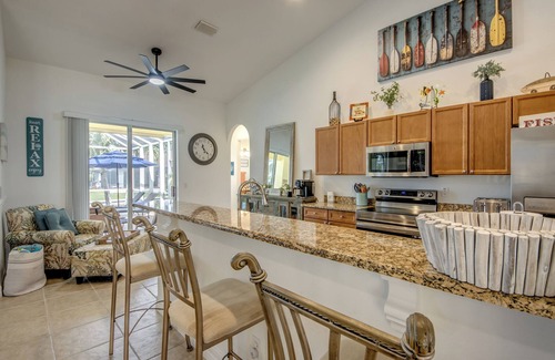 Pelican Villa | Capacious 4 BR/3 bath waterfront Villa with heated pool, spa, kayaks and bikes