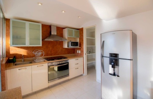 El Yaqui Condo | Capitalia - Chic Renovated w/Garden