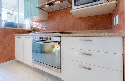 El Yaqui Condo | Capitalia - Chic Renovated w/Garden