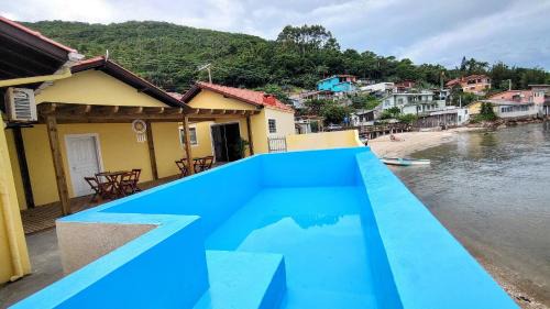 Florianopolis House | Casa pé na areia com vista especial do pôr do sol.