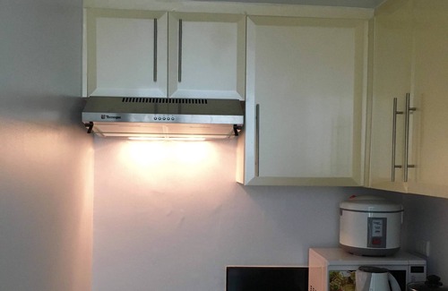 Pasay Condo | CF10C The Parkside Villas, Family room with kichen, dining,living area & balcony