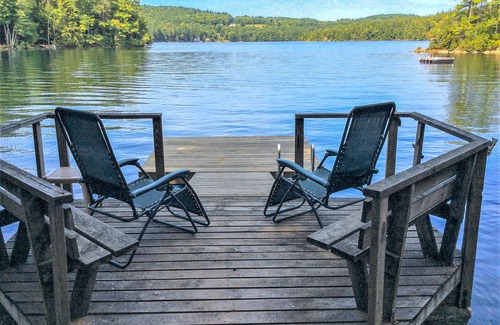 Meredith Cottage | Chalet-style lakefront home with private dock, beach, kayak, canoe & epic view