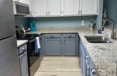 Mary Esther House | Charming 2-bedroom townhome with sound access, pool and grill