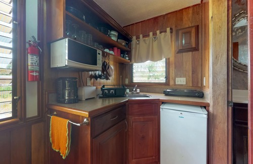 Hopkins Apartment | Charming cabana with a porch, hammock, strong WiFi, and a shared pool & grill