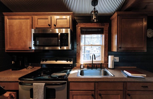 Beach City Cabin | Charming cabin for 2, with private hot tub and peaceful creek