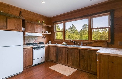 White Oak Cabin | Charming cabin with Fire pit, outdoor seating and grill, covered pavillion.