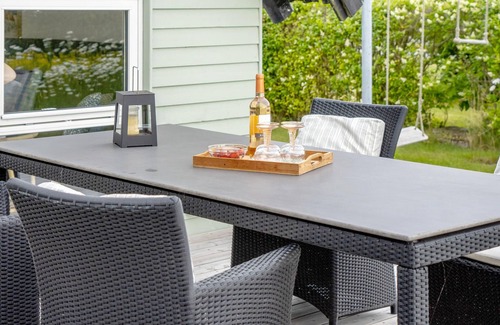 Tørresø House | Charming cottage with fireplace and beautiful view of fields.