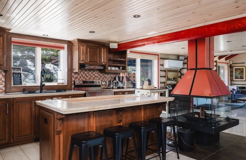 Mandeville Cabin | Charming log cabin nestled in the woods, with a spa and in-ground pool.