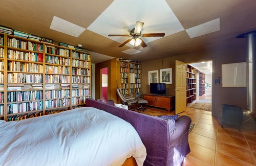 Taos House | Charming secluded home mountain views, covered front porch, & book collection
