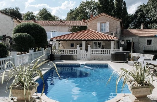 Chenon House | Charming updated and 4-bedroom mill house on the river with fantastic views.