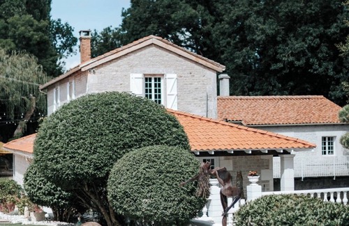 Chenon House | Charming updated and 4-bedroom mill house on the river with fantastic views.
