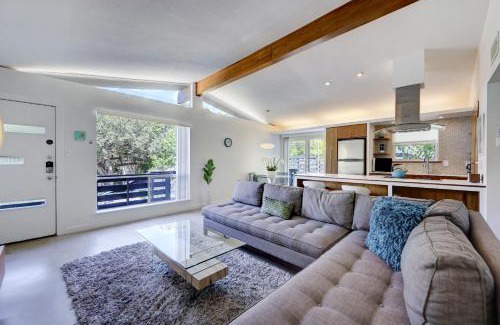 South River City House | Cheery Modern Retreat near SoCo & Downtown by Lodgewell