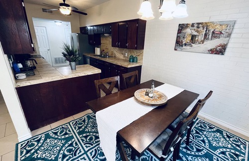 Midland Condo | Chic brick interior condo lit by string lights