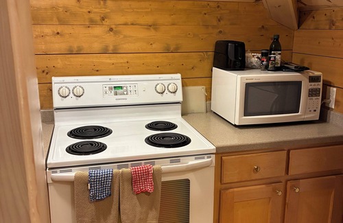 Wiley House | Chic & Comfy Suite & Covered Blue Stone Patio with Fireplace & Waterfall View