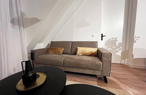 Goirle Apartment | Chic stay with parking, WiFi, and modern amenities near shops and scenic trails. Sleeps four guests.