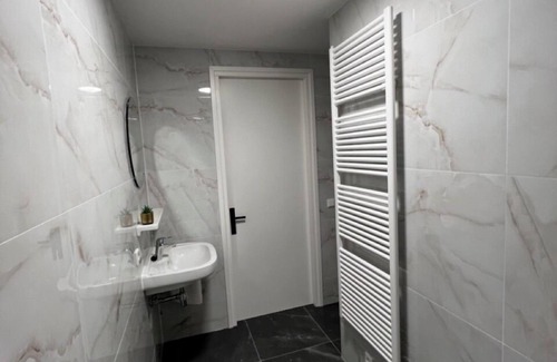 Goirle Apartment | Chic stay with parking, WiFi, and modern amenities near shops and scenic trails. Sleeps four guests.