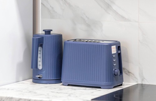 Bow West House | City Sophistication: Chic 3-BR for Modern Living