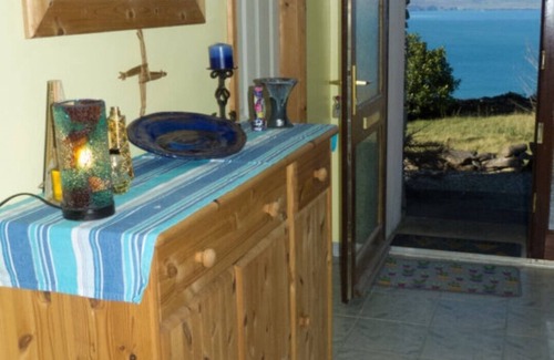 Kells House | Coastal Cottage with magnificent sea and mountains.