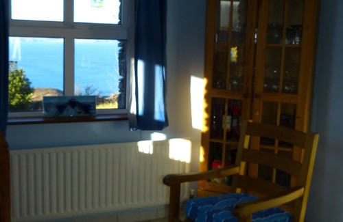 Kells House | Coastal Cottage with magnificent sea and mountains.
