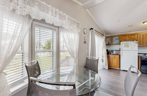 Assateague Pointe House | Coastal living with on-site pool, playground, grills, central AC, & washer/dryer