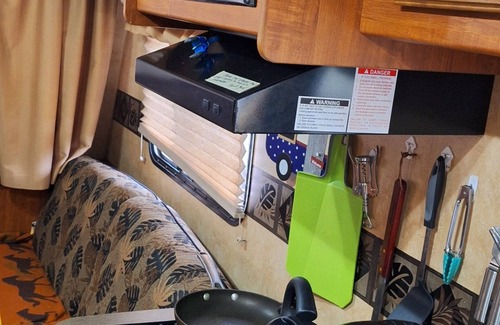 Forestville RV Rental | Comfortable Camper a few miles off thruway and area attractions. Fire ring wood