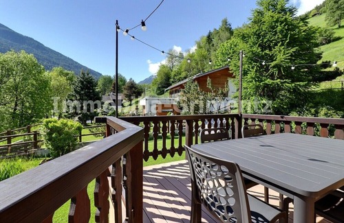 Lauenen Bei Gstaad Ski Chalet | Comfortable chalet on 3 levels for 5 people in Mayoux, living room with wood-burner, kitchen area wi
