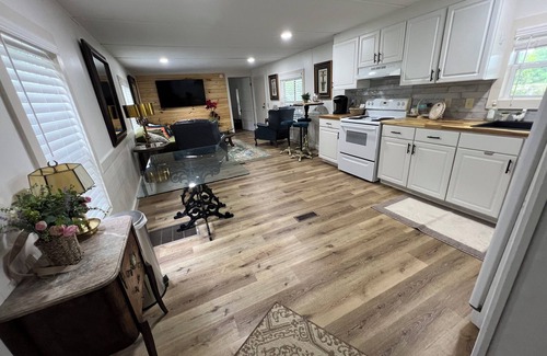 Moultrie House | Completely renovated mobile home sitting own a pond.